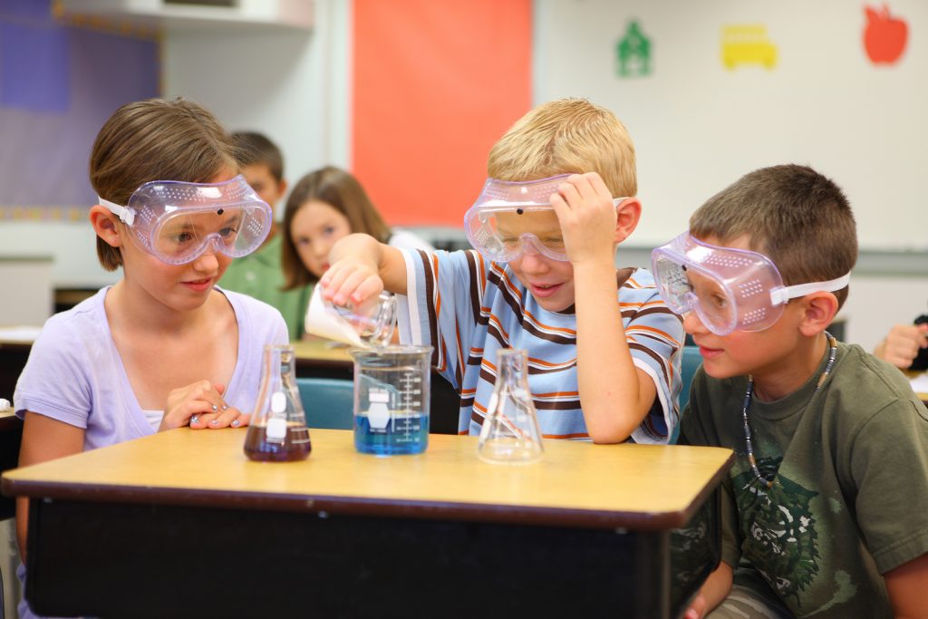 Elementary school students doing science experiment